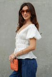 White Smocked Peplum Top